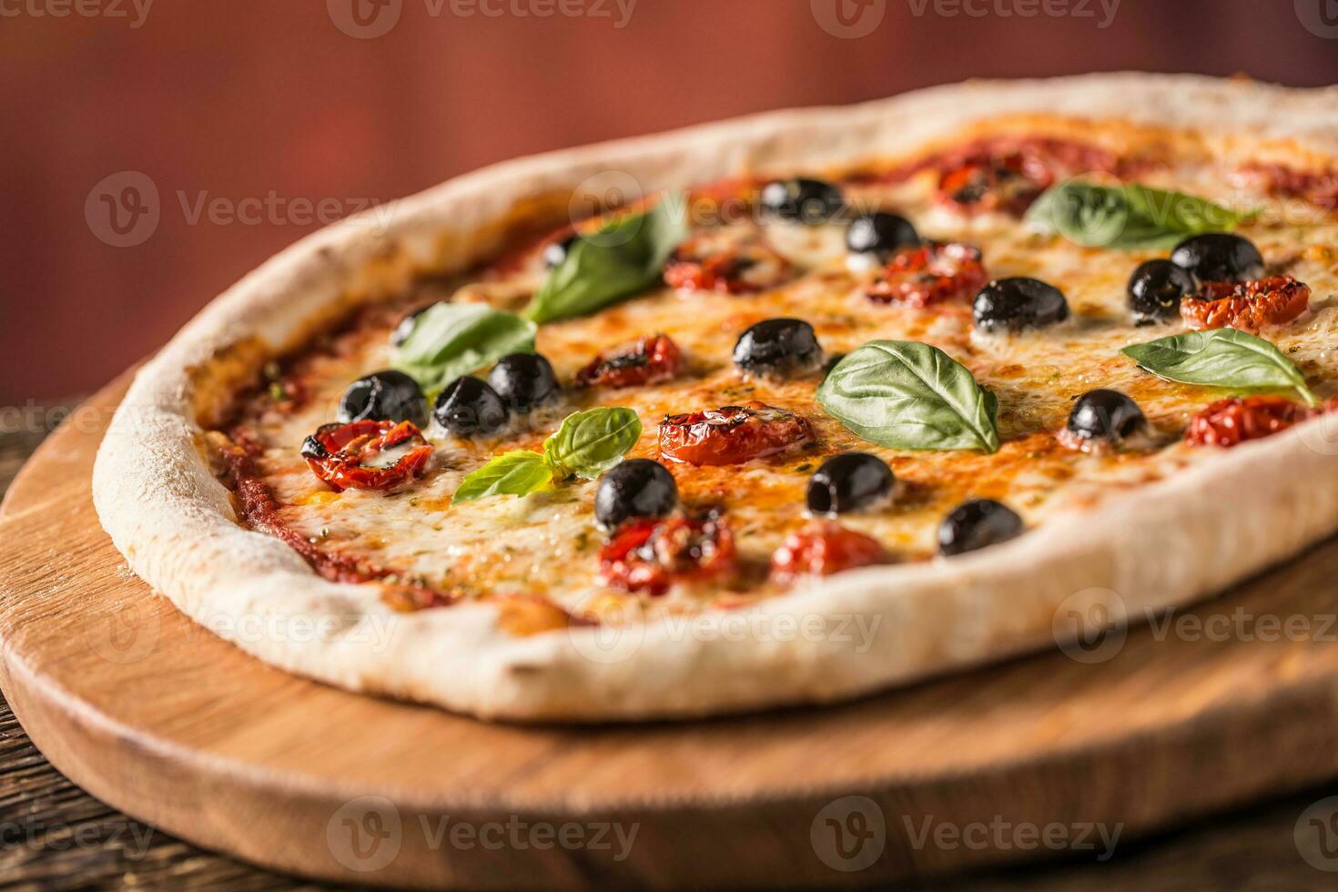 Pizza. Tasty fresh italian pizza served on old wooden table photo