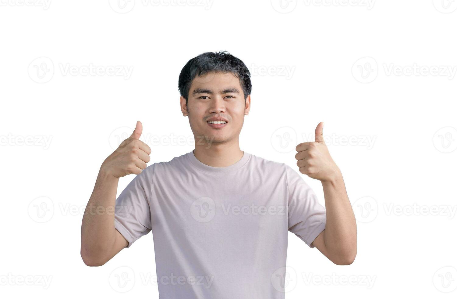 Young Asian handsome man wearing a casual t-shirt standing over white background approving doing positive gestures with his hand, thumbs up smiling, and happy for success. Winner gesture. photo