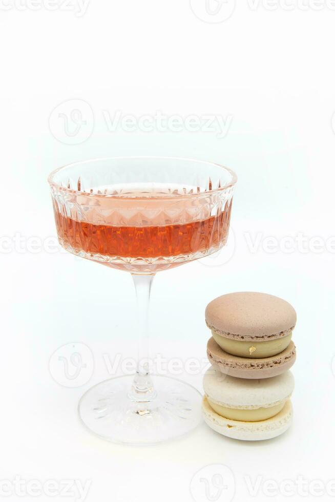 Macaroon and wine on a light background. photo