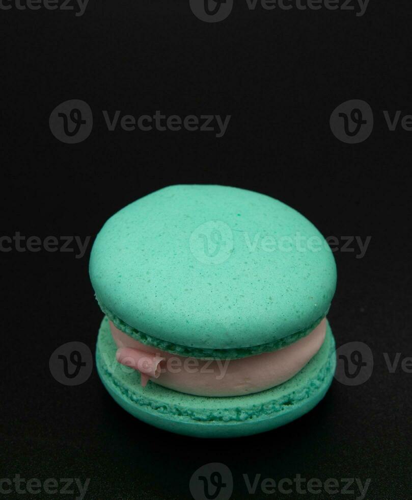 Macaroon on a black background. photo