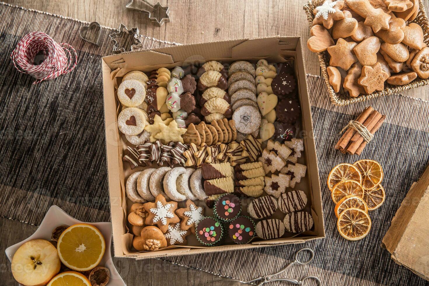 Box full of christmas sweet cokies and pastry photo