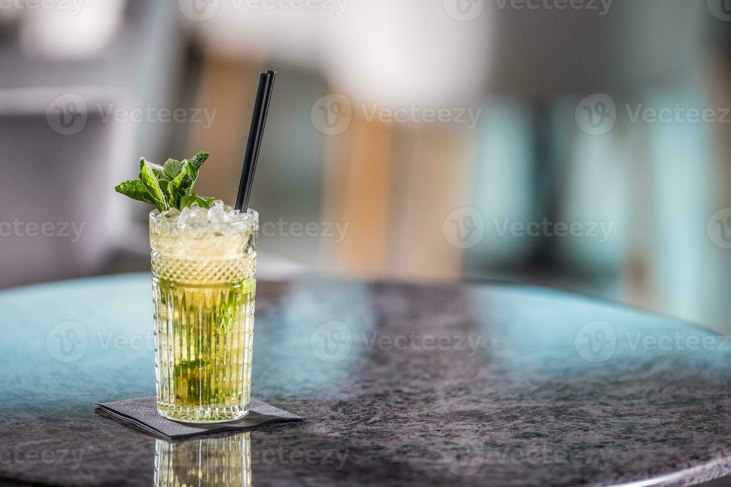 Mojito summer alcoholic cocktail on table in restaurant photo