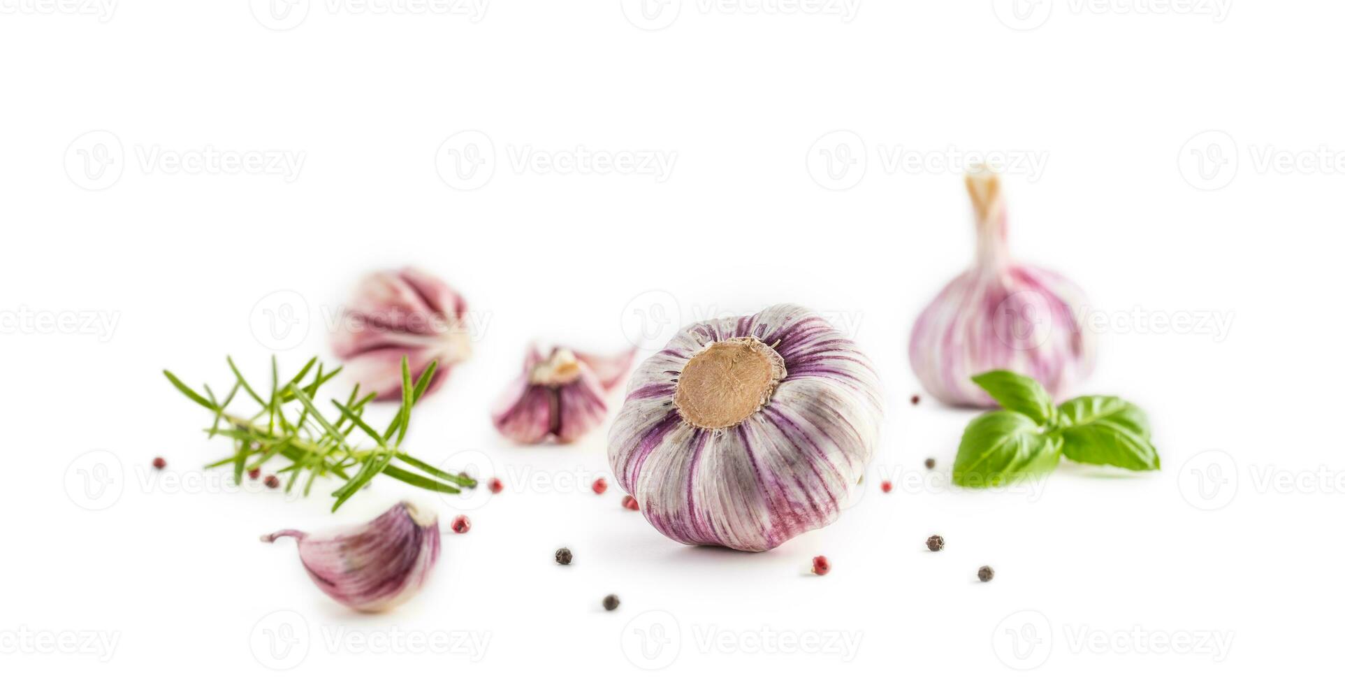 Garlic Cloves and Bulbs with rosemary and pepper. photo