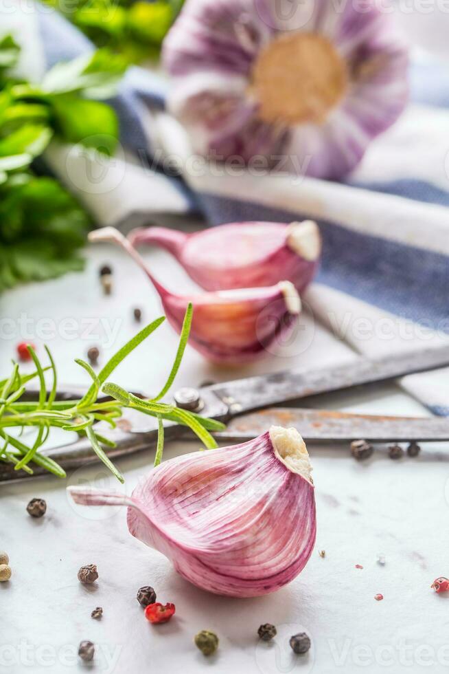 Garlic Cloves and Bulbs with rosemary salt and pepper. photo