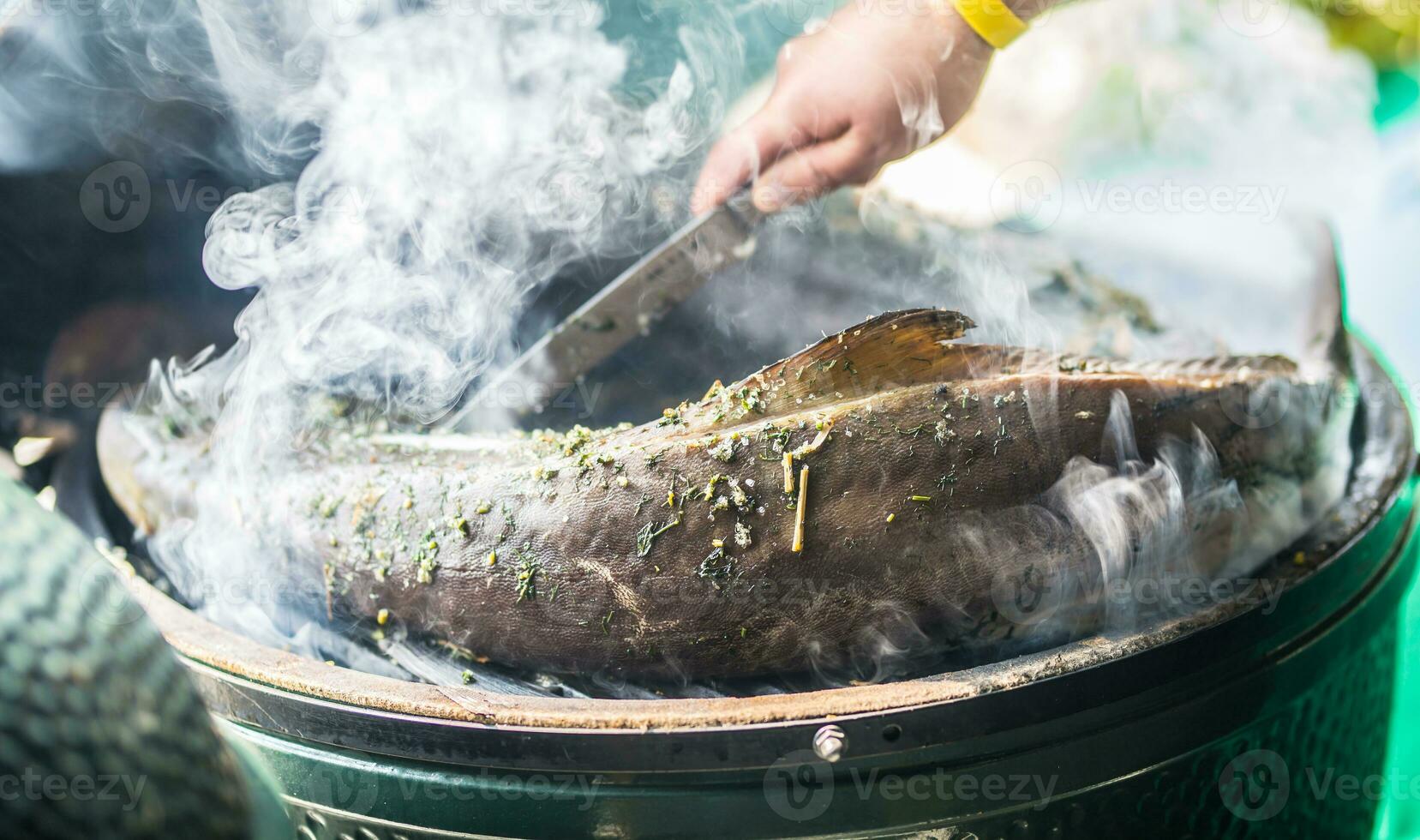 Smoked fish garden grill and smoke the process of smoking photo