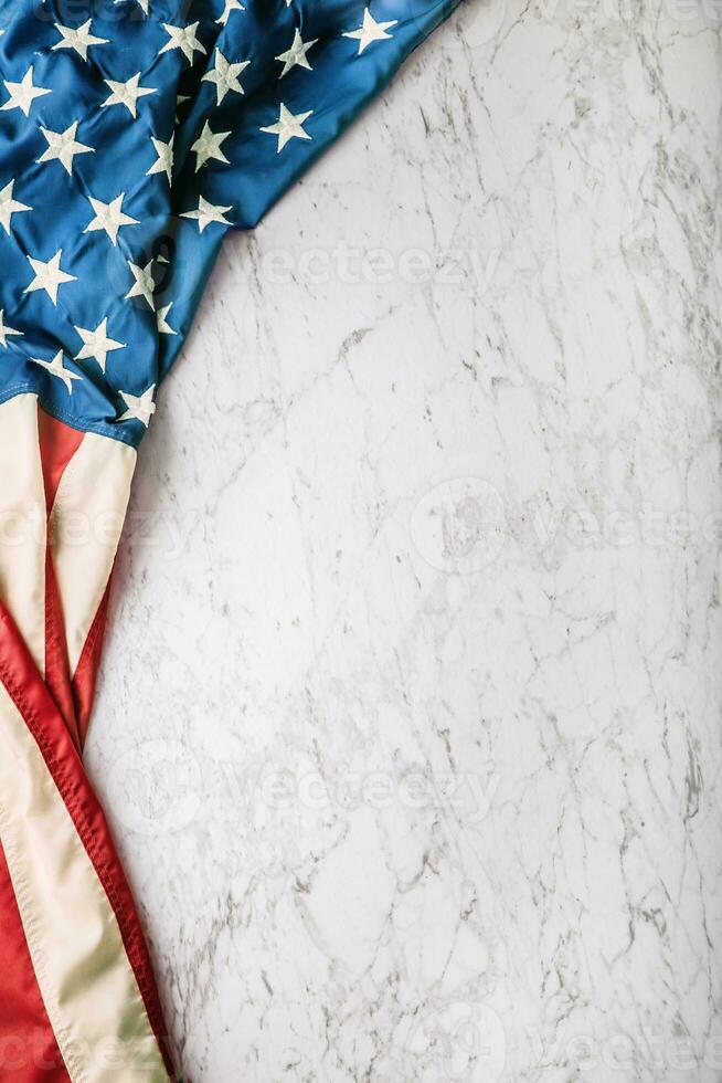 Close-up american flag on white marble background photo