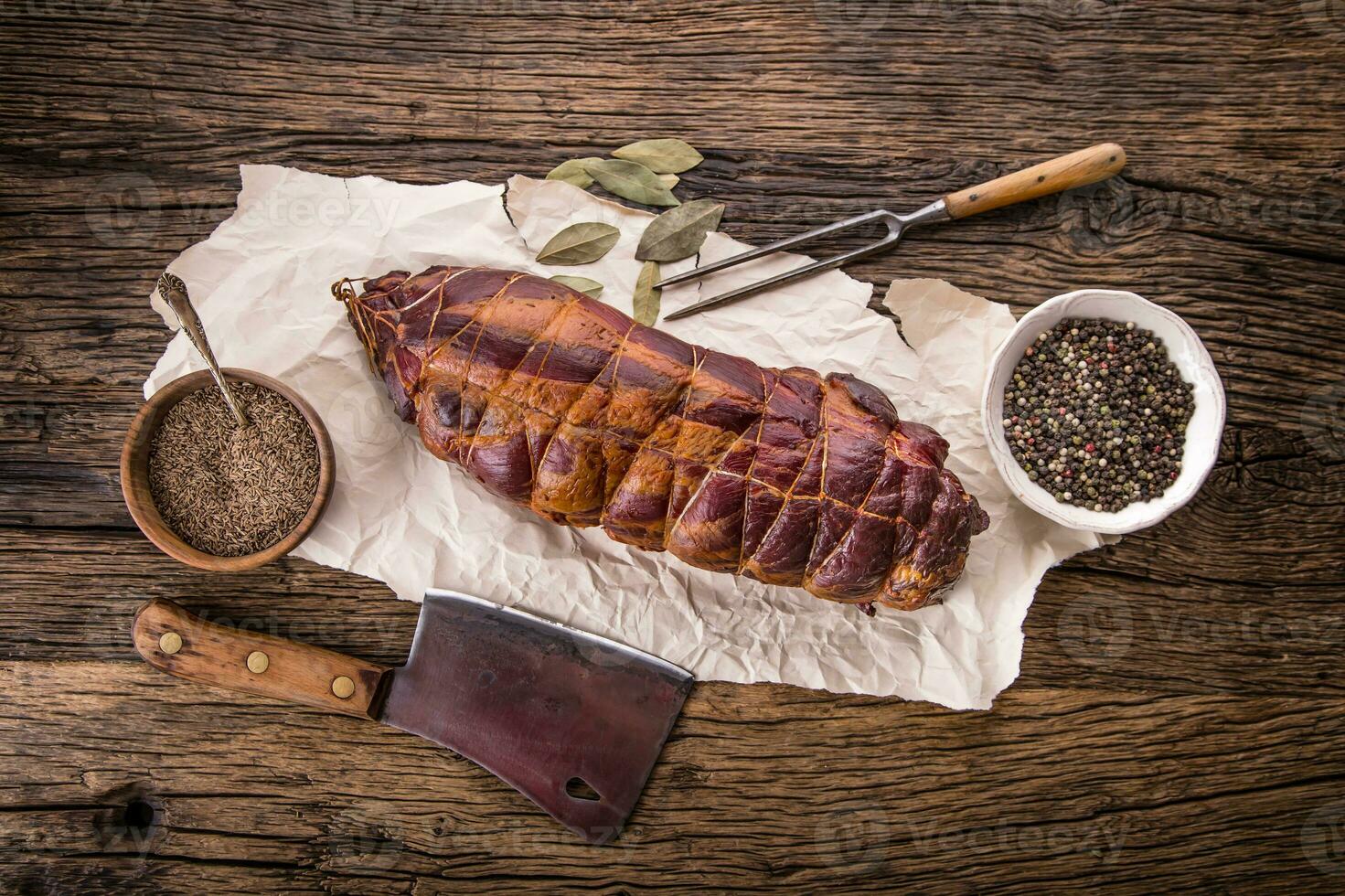 Pork meat.Pork chop smoked. Traditional smoked meat on oak wooden table in other positions. photo