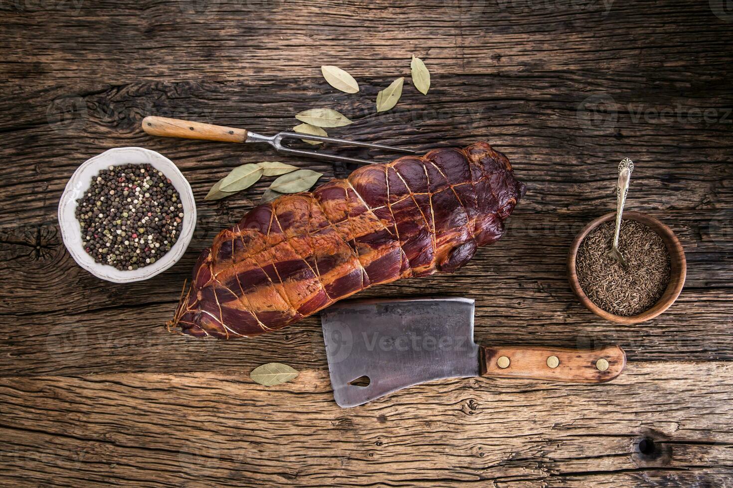 Pork meat.Pork chop smoked. Traditional smoked meat on oak wooden table in other positions. photo