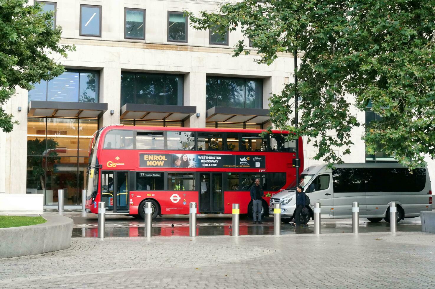 Gorgeous Low Angle view of Bus Service and British Traffic at Central London City of England UK. Image Captured on August 2nd, 2023 During Cloudy and Rainy Day. photo