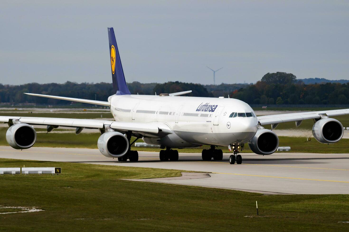 Lufthansa passenger plane at airport. Schedule flight travel. Aviation and aircraft. Air transport. Global international transportation. Fly and flying. photo