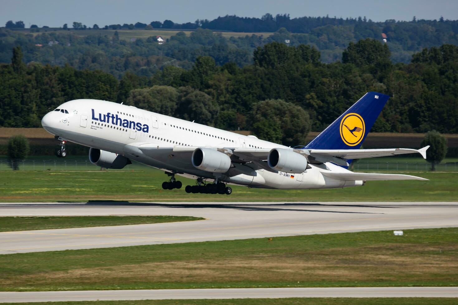 Lufthansa passenger plane at airport. Schedule flight travel. Aviation and aircraft. Air transport. Global international transportation. Fly and flying. photo