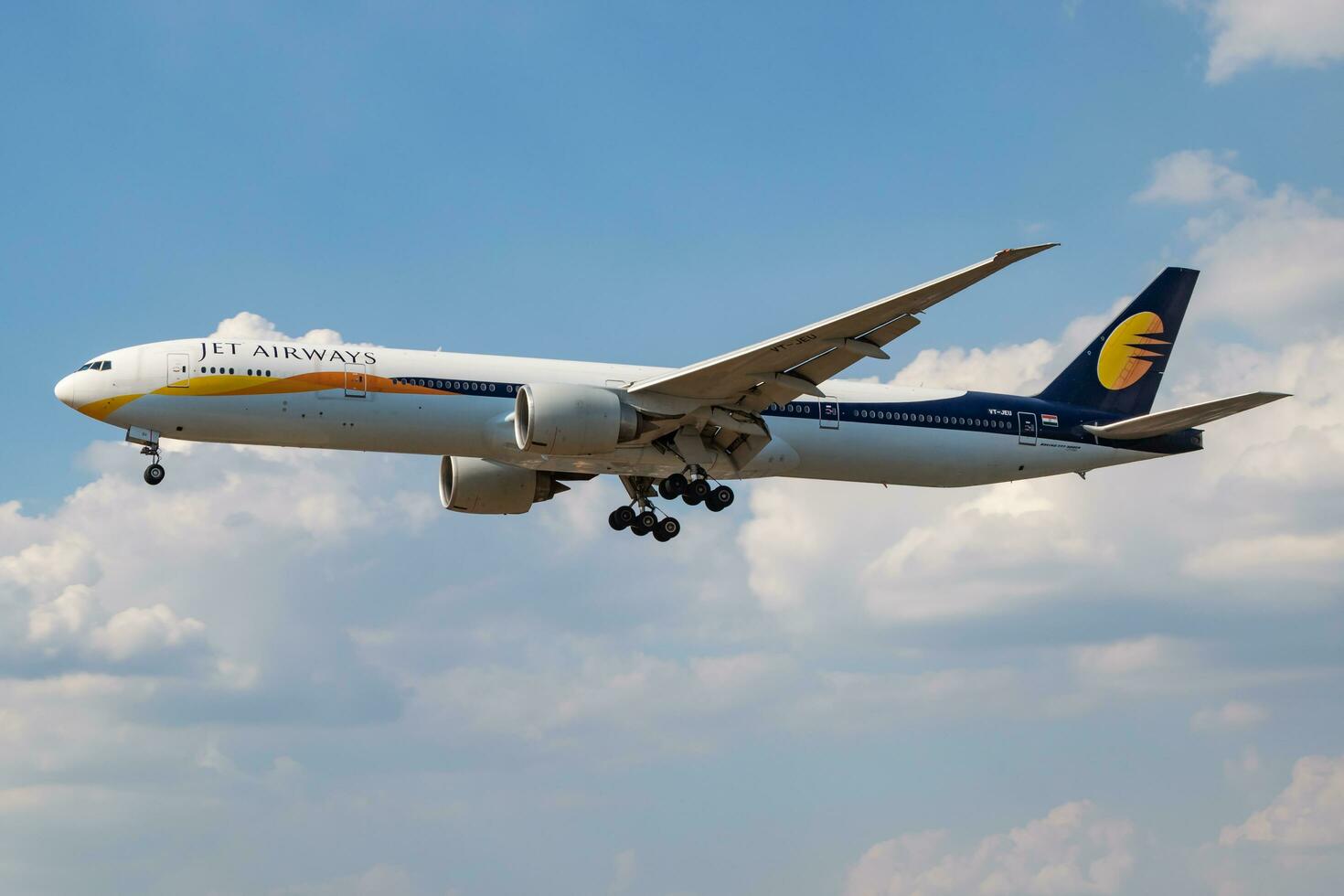 Jet Airways Boeing 777-300ER VT-JEU passenger plane landing at London Heathrow Airport photo