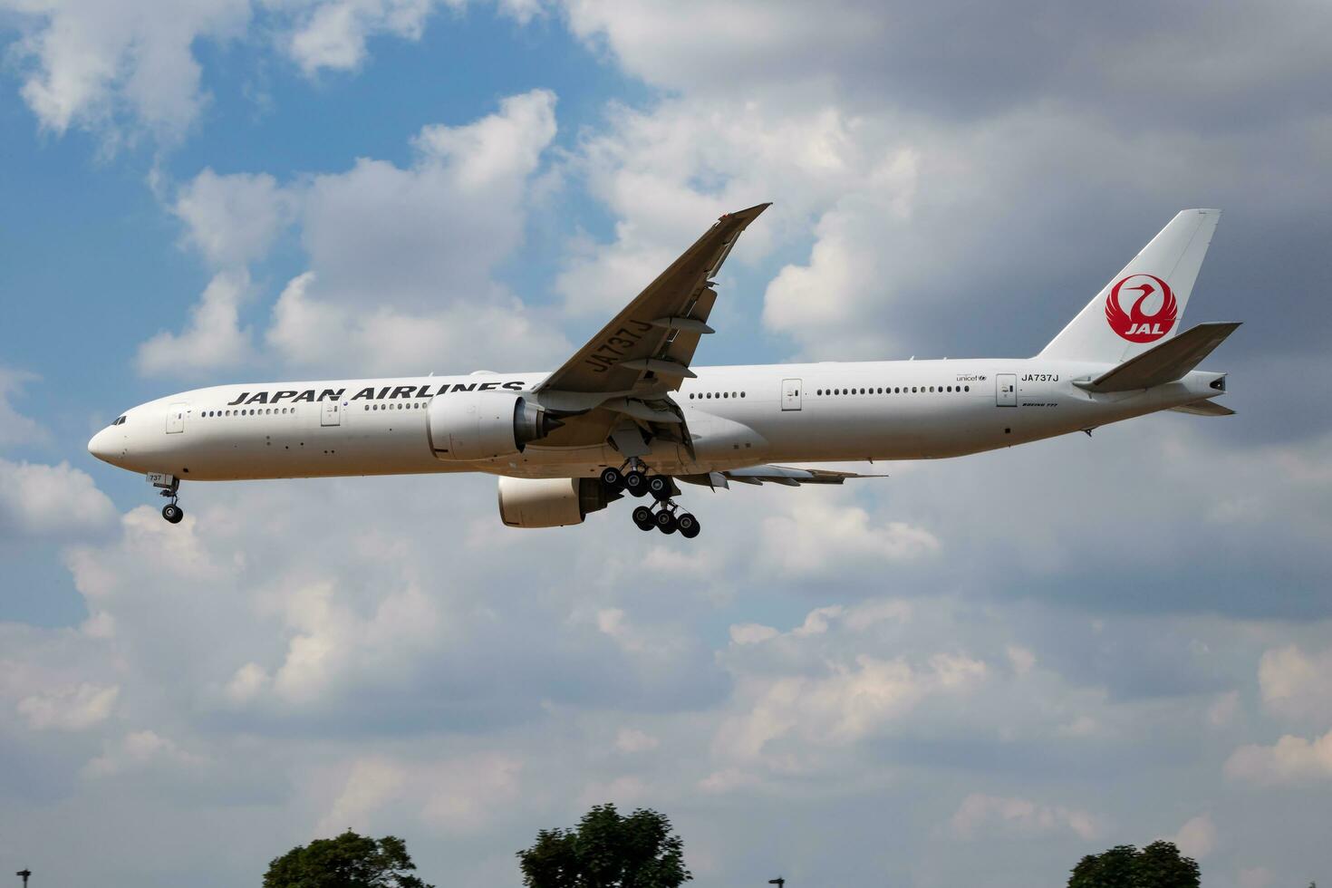 JAL Japan Airlines Boeing 777-300ER JA737J passenger plane landing at London Heathrow Airport photo