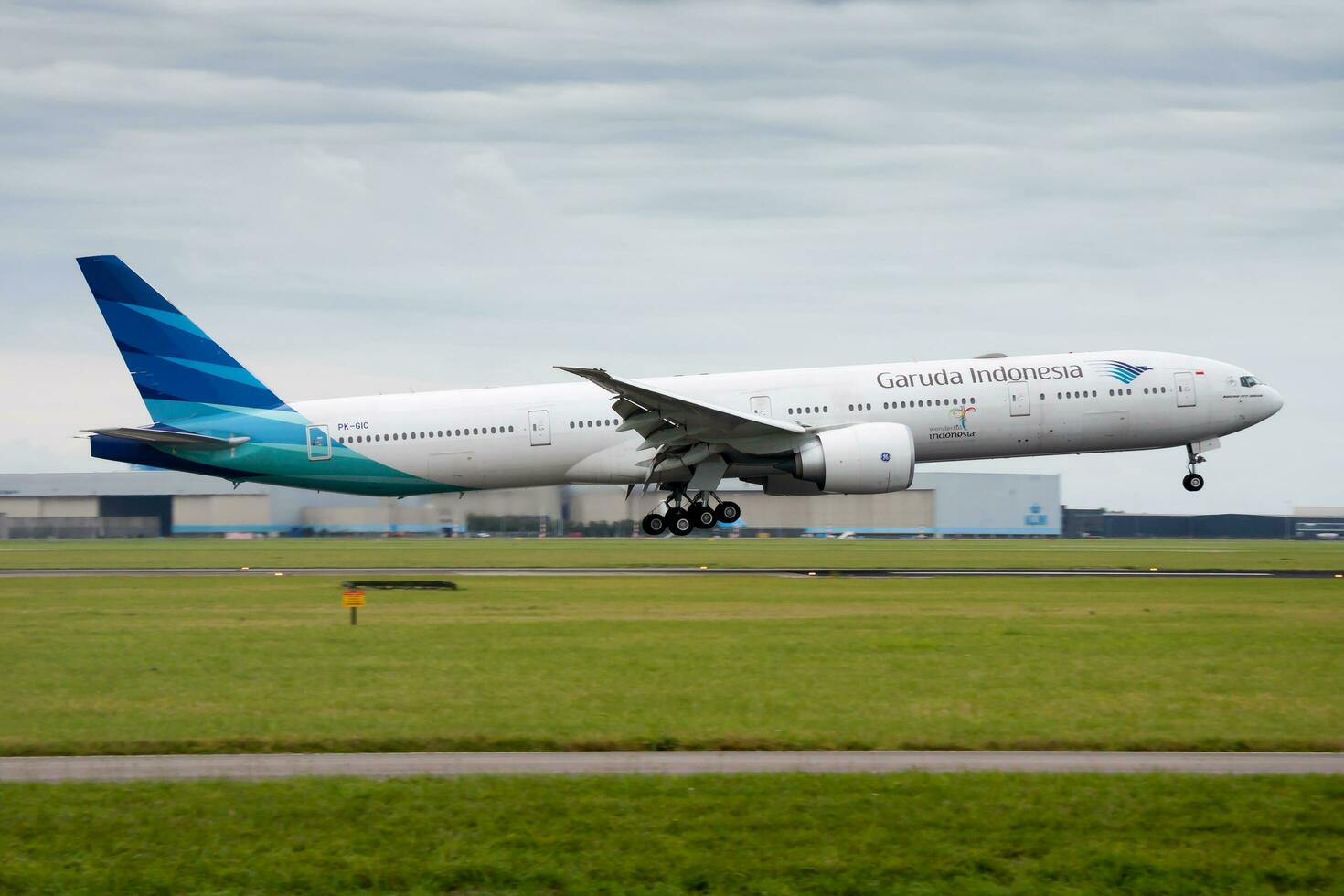 Garuda Indonesia Boeing 777-300ER PK-GIC passenger plane landing at Amsterdam Schipol Airport photo