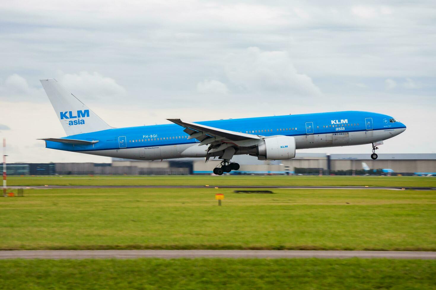 KLM Royal Dutch Airlines Boeing 777-200 PH-BQI passenger plane arrival and landing at Amsterdam Schipol Airport photo