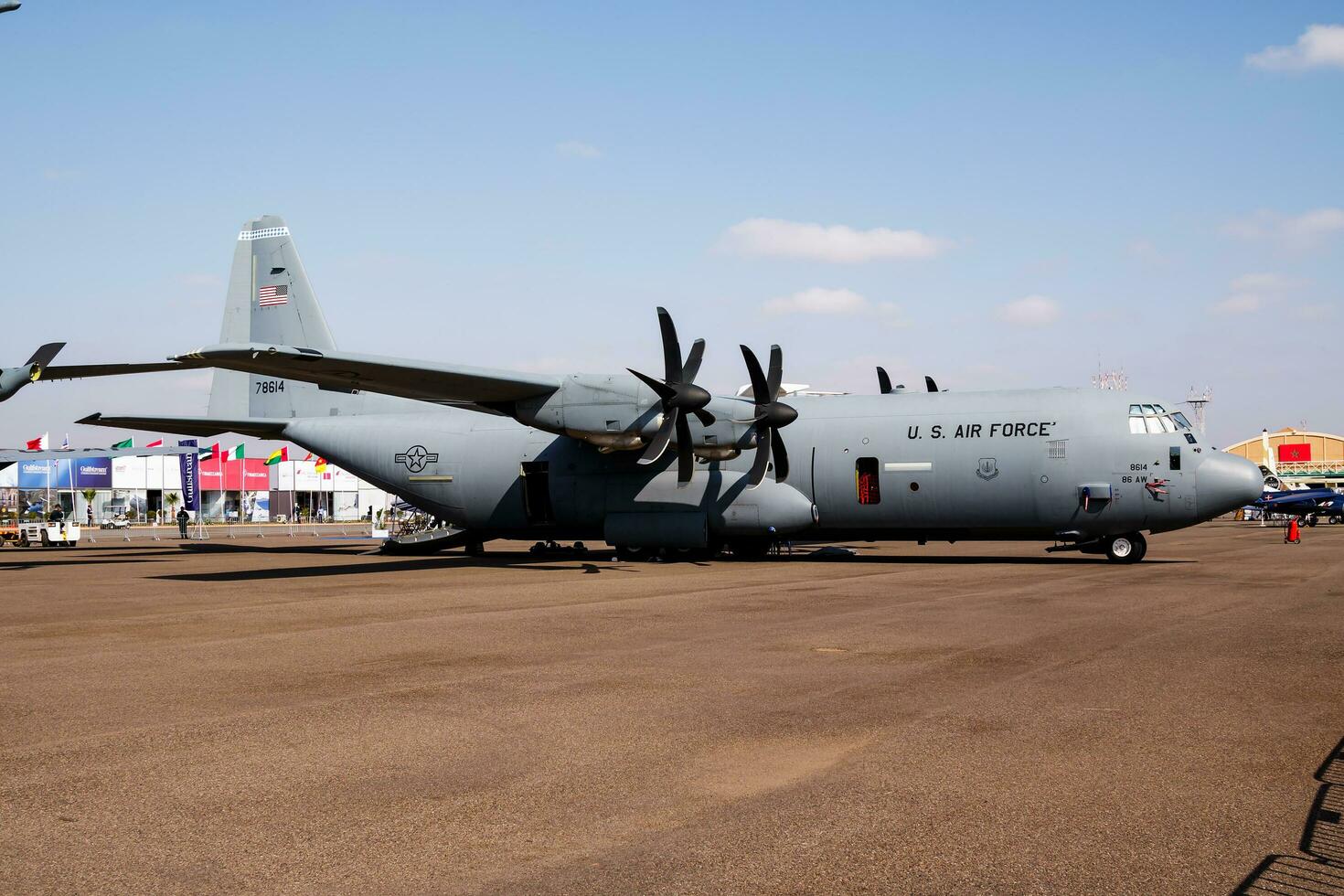 Military transport plane at air base. Air force flight operation. Aviation and aircraft. Air lift. Military industry. Fly and flying. photo