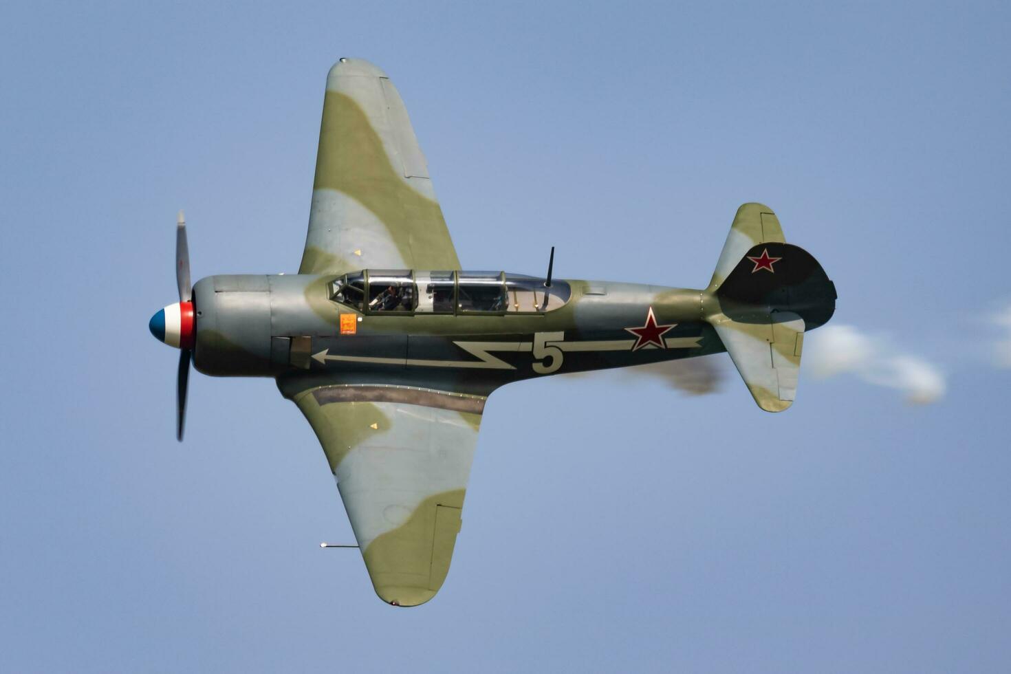 Old timer warbird at air base and airfield. Cold war and World War aviation. Airshow display. Aged military warplane aircraft. Fly and flying. photo