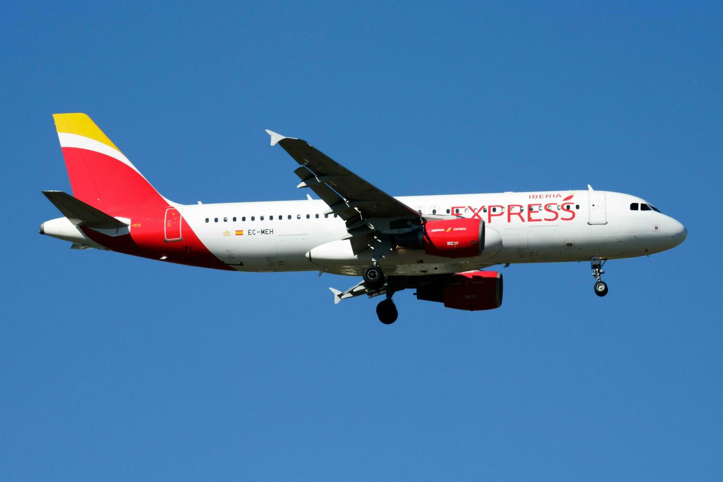 Iberia Express Airbus A320 EC-MEH passenger plane landing at Madrid Barajas Airport photo