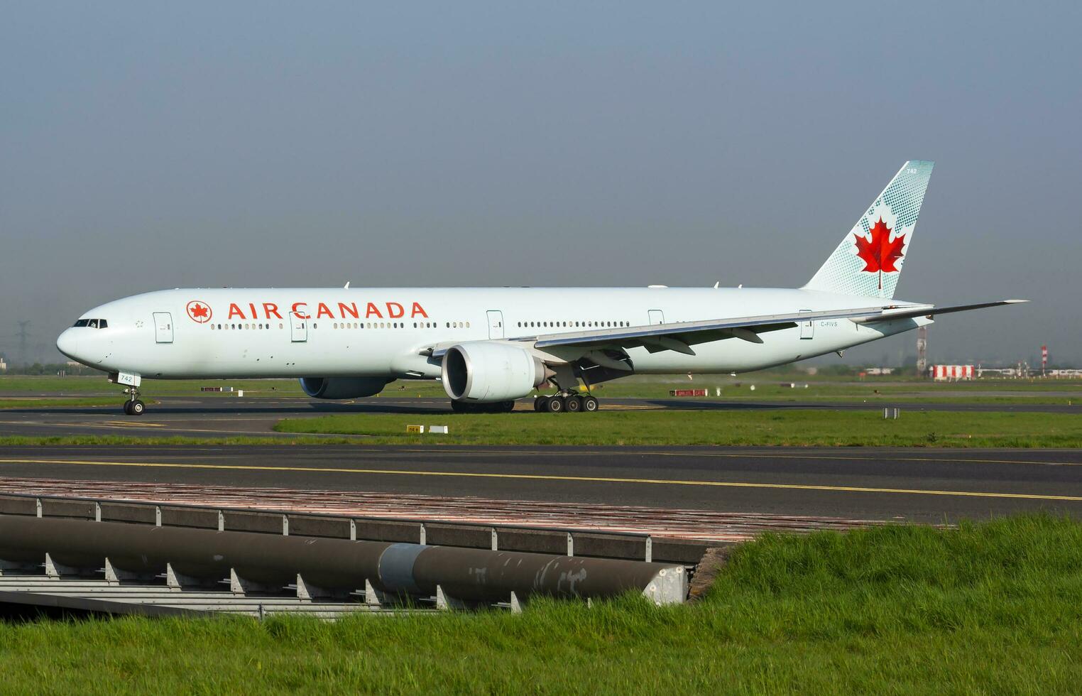 Air Canada Boeing 777-300ER C-FIVS passenger plane arrival and landing at Paris Charles de Gaulle Airport photo