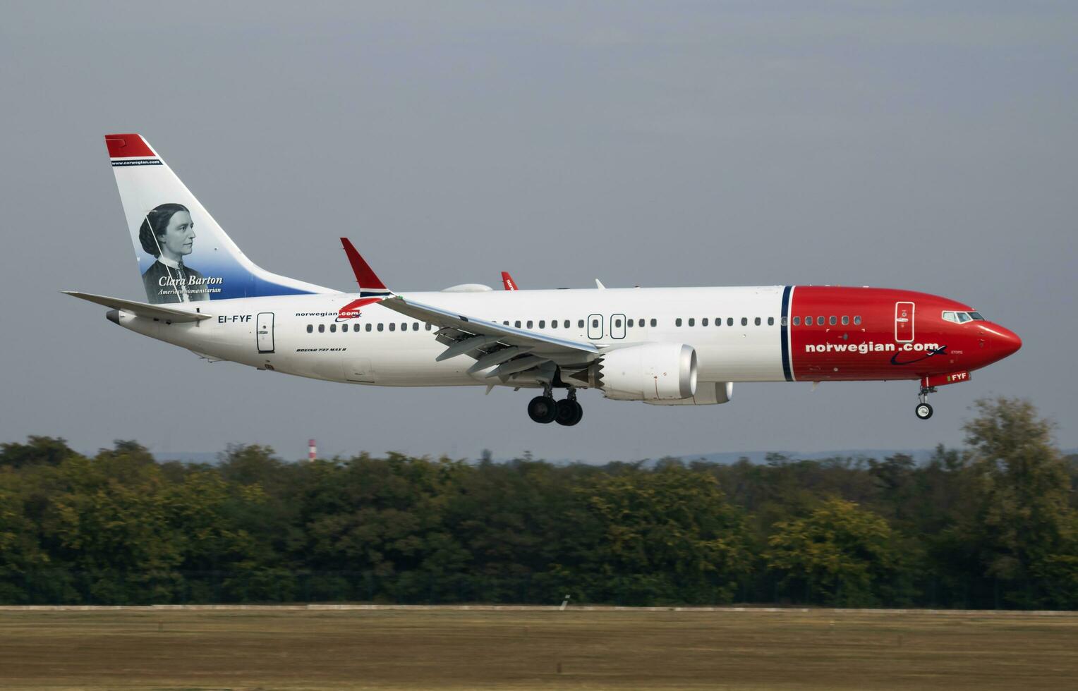 Norwegian Air Shuttle Boeing 737 MAX 8 EI-FYF passenger plane arrival and landing at Budapest Airport photo