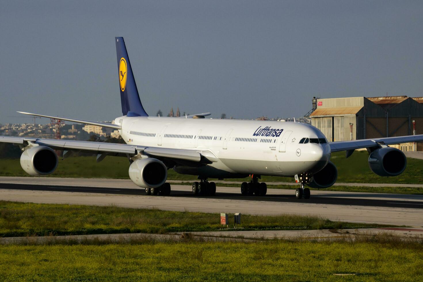 Lufthansa passenger plane at airport. Schedule flight travel. Aviation and aircraft. Air transport. Global international transportation. Fly and flying. photo