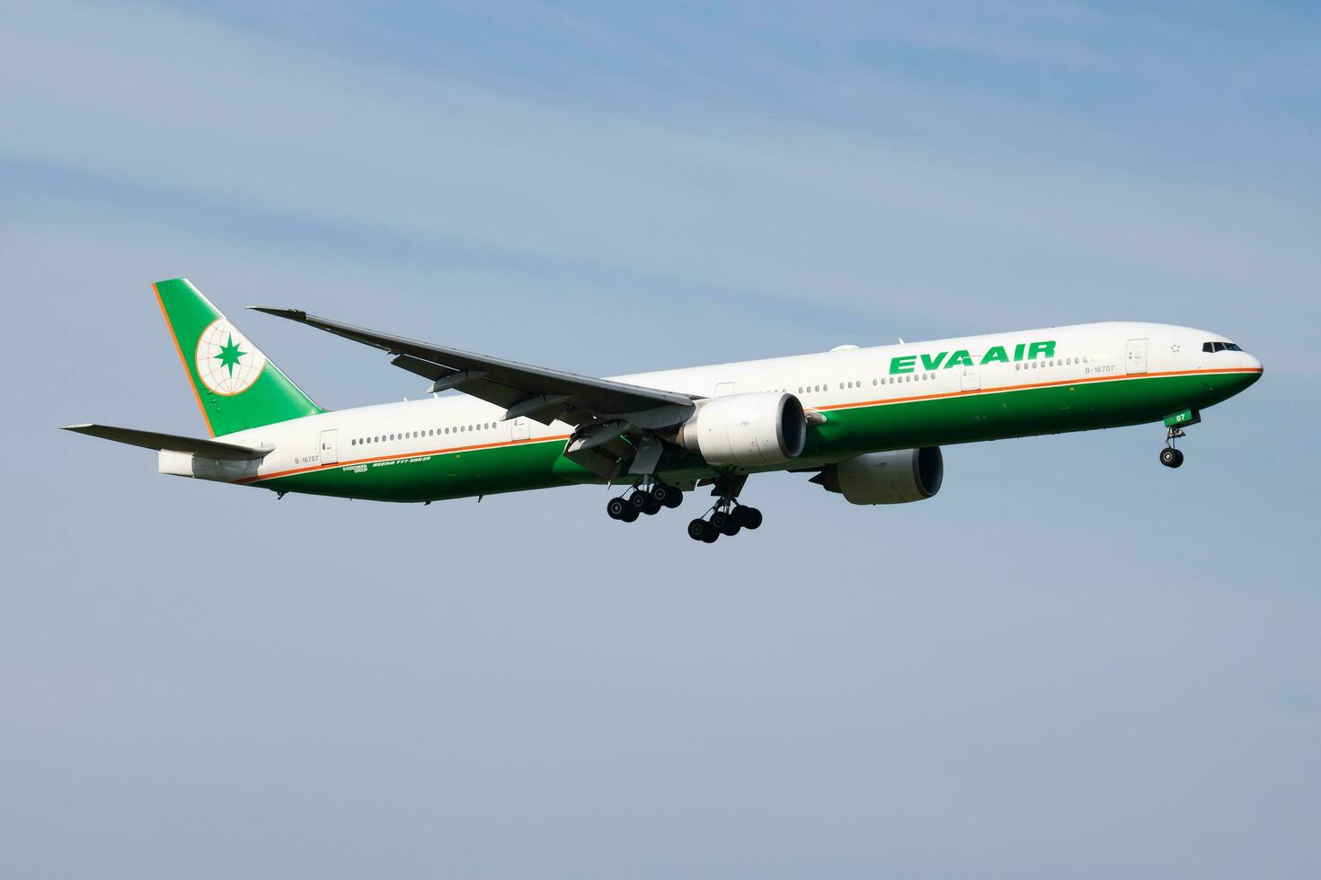 EVA Air Boeing 777-300ER B-16707 passenger plane arrival and landing at Vienna Airport photo