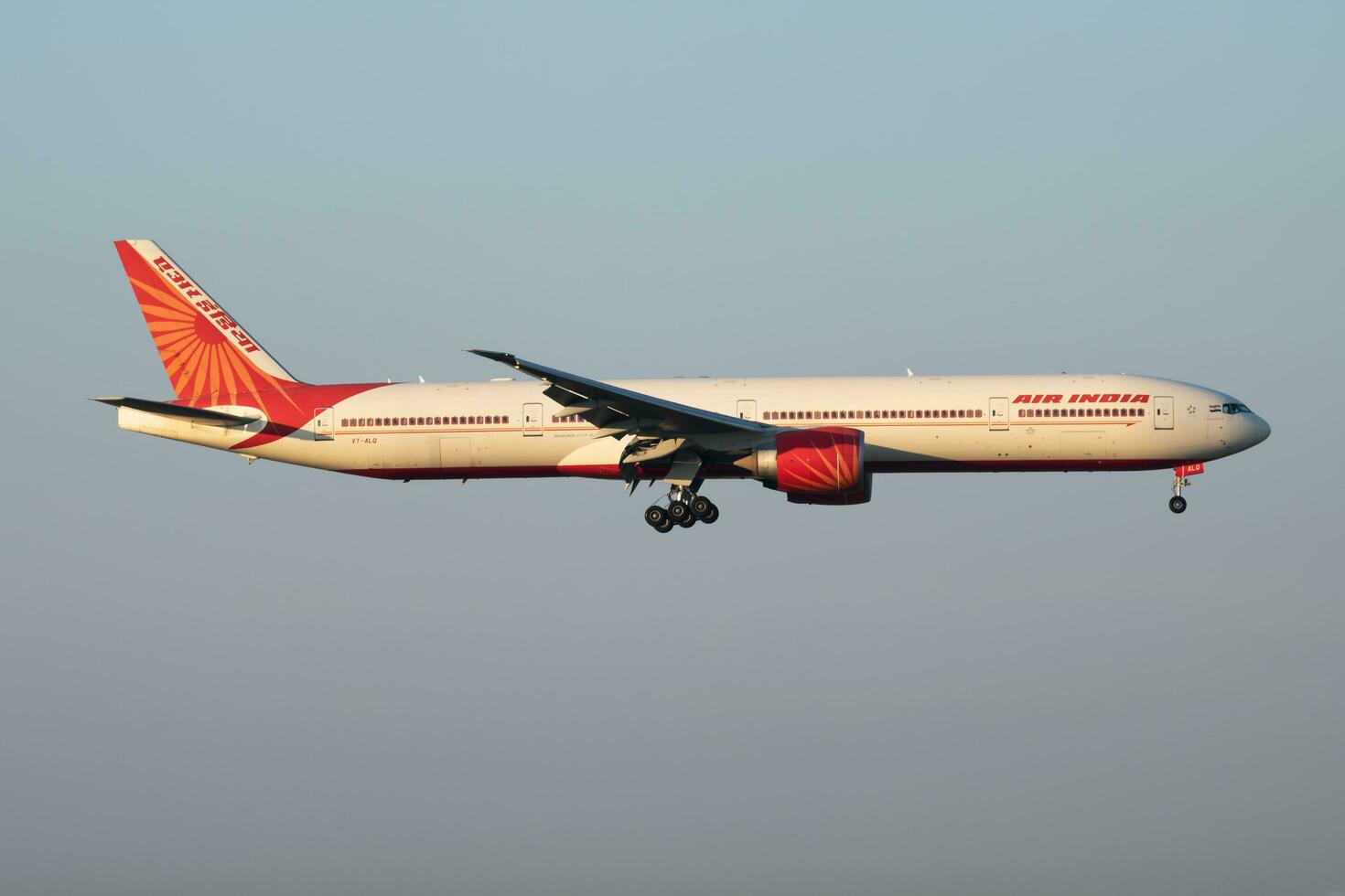 Air India Boeing 777-300ER VT-ALQ passenger plane arrival and landing at Vienna International Airport photo