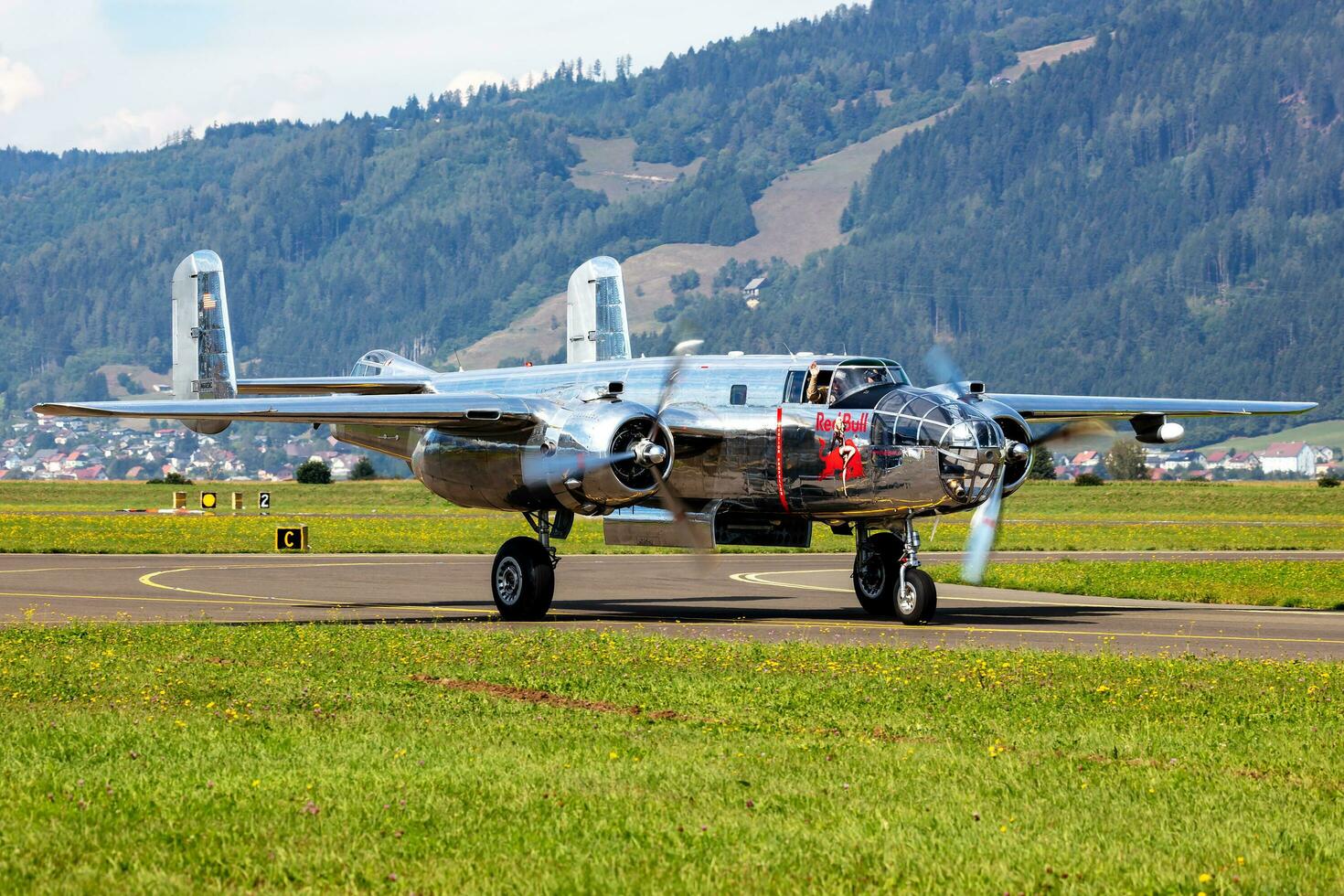 Old timer warbird at air base and airfield. Cold war and World War aviation. Airshow display. Aged military warplane aircraft. Fly and flying. photo