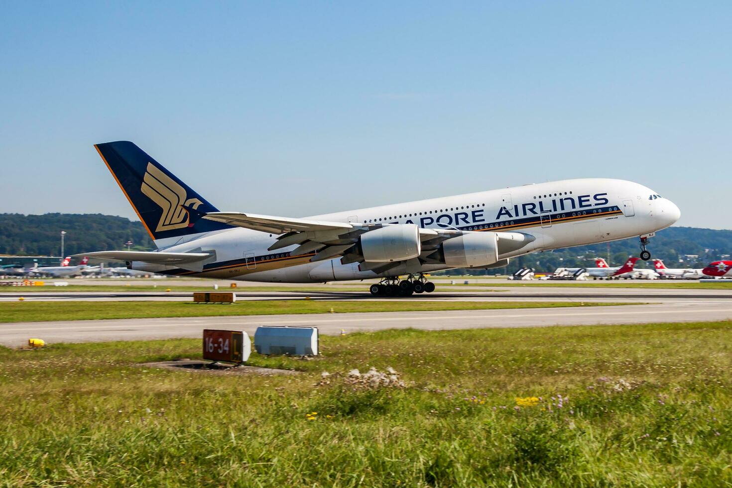 Singapore Airlines passenger plane at airport. Schedule flight travel. Aviation and aircraft. Air transport. Global international transportation. Fly and flying. photo