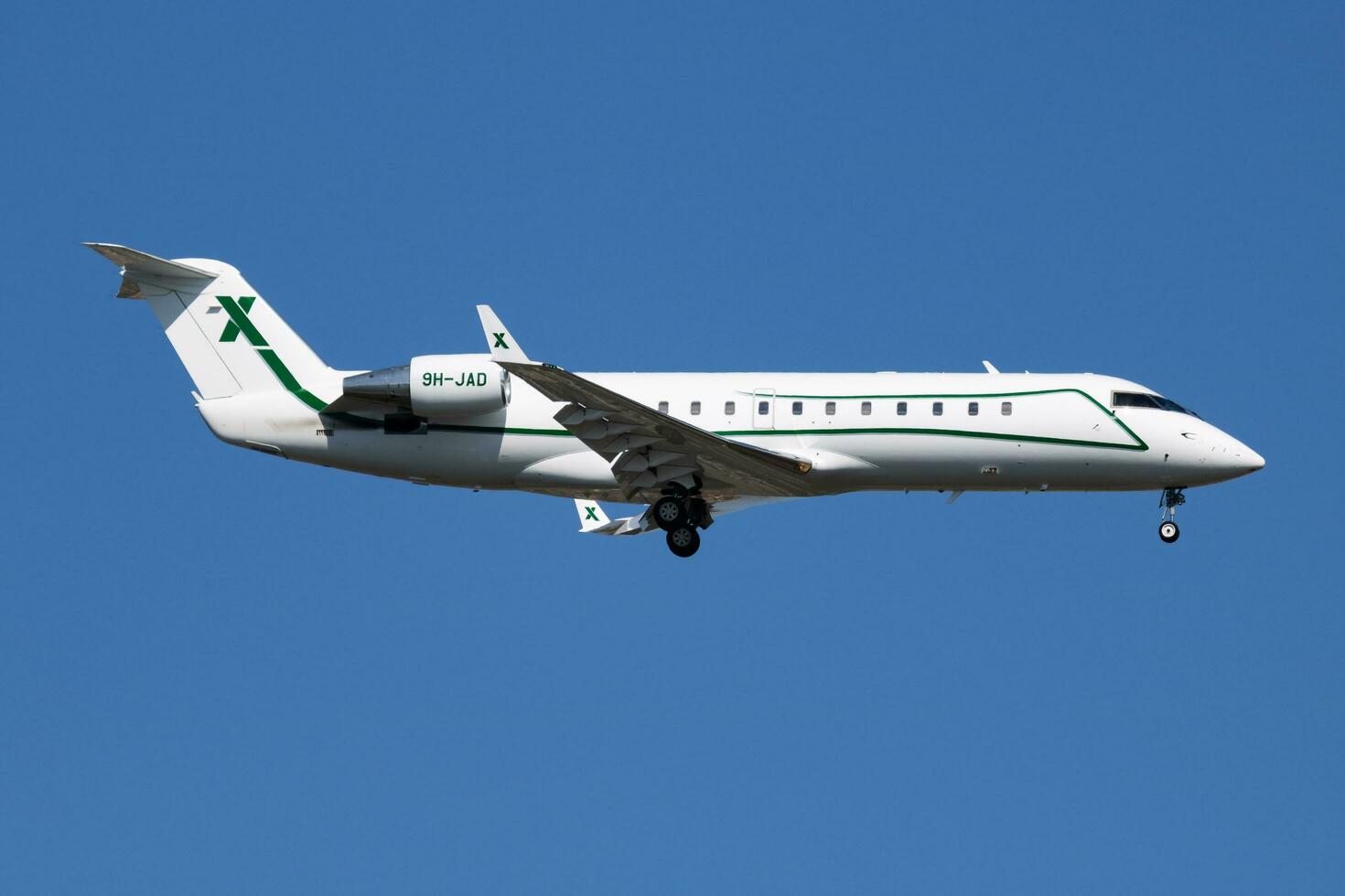 Air X Charter Bombardier CL-600 Challenger 850 9H-JAD business jet arrival and landing at Istanbul Ataturk Airport photo