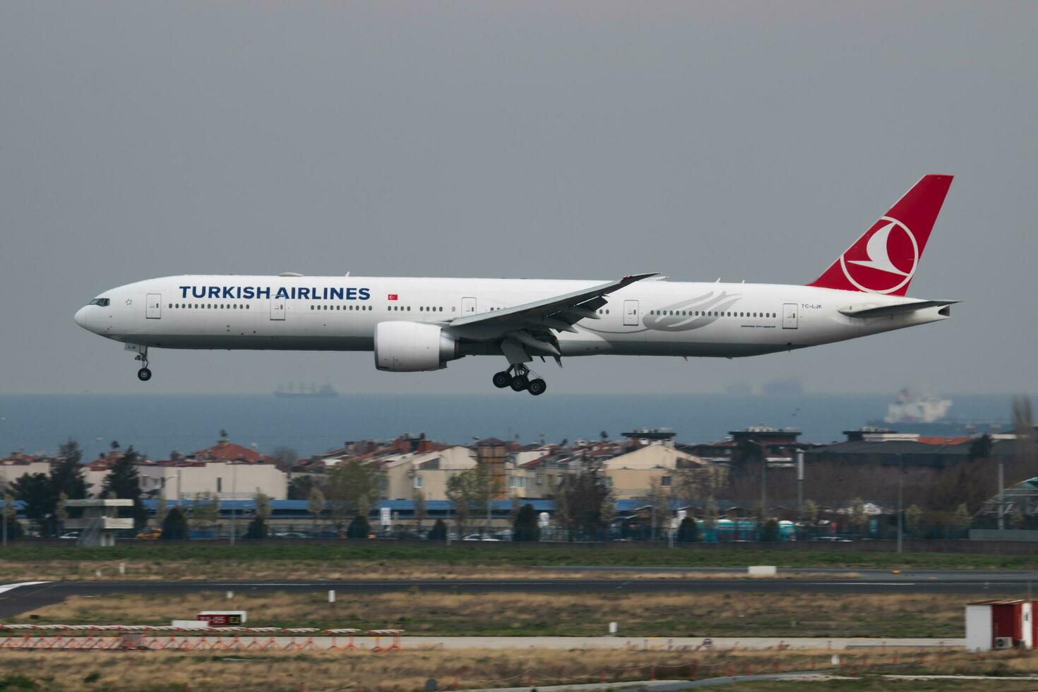 Turkish Airlines Boeing 777-300ER TC-LJK passenger plane landing at Istanbul Ataturk Airport photo