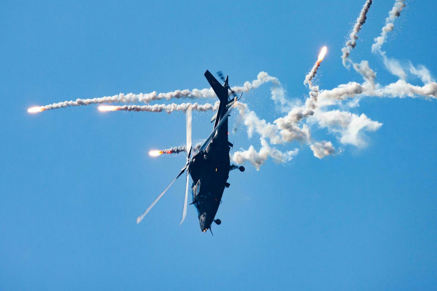 Military helicopter at air base. Air force flight operation. Aviation and aircraft. Air defense. Military industry. Fly and flying. photo