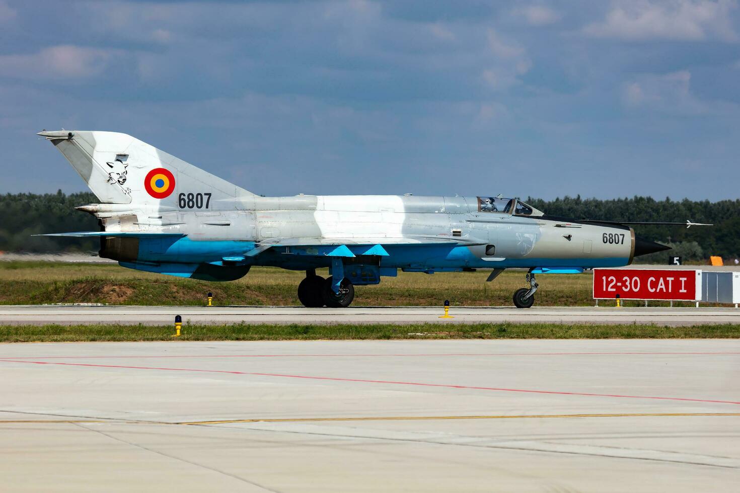 MiG-21 military fighter jet plane at air base. Air force flight operation. Aviation and aircraft. Air defense. Military industry. Fly and flying. photo