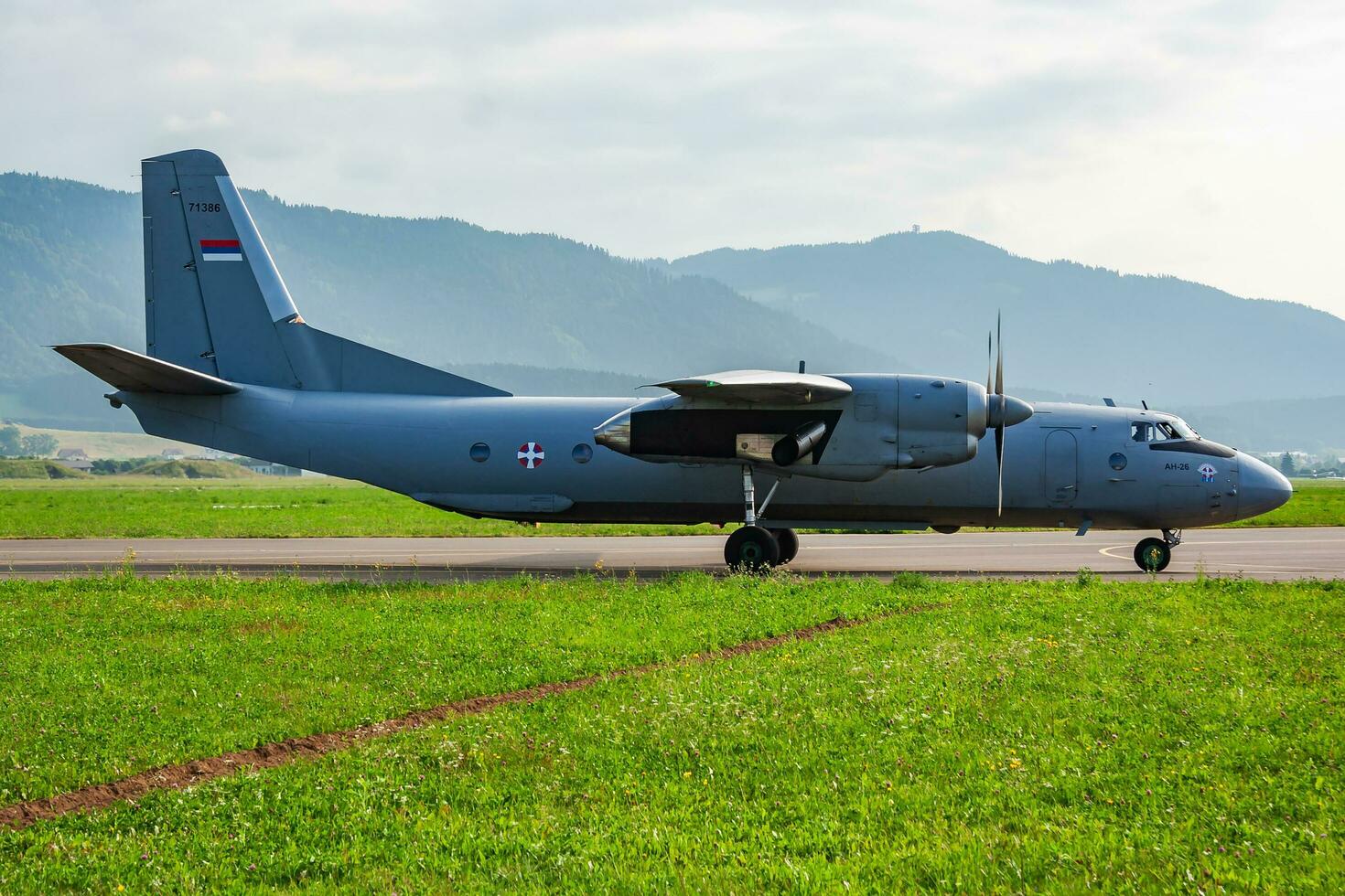 Military transport plane at air base. Air force flight operation. Aviation and aircraft. Air defense. Military industry. Fly and flying. photo