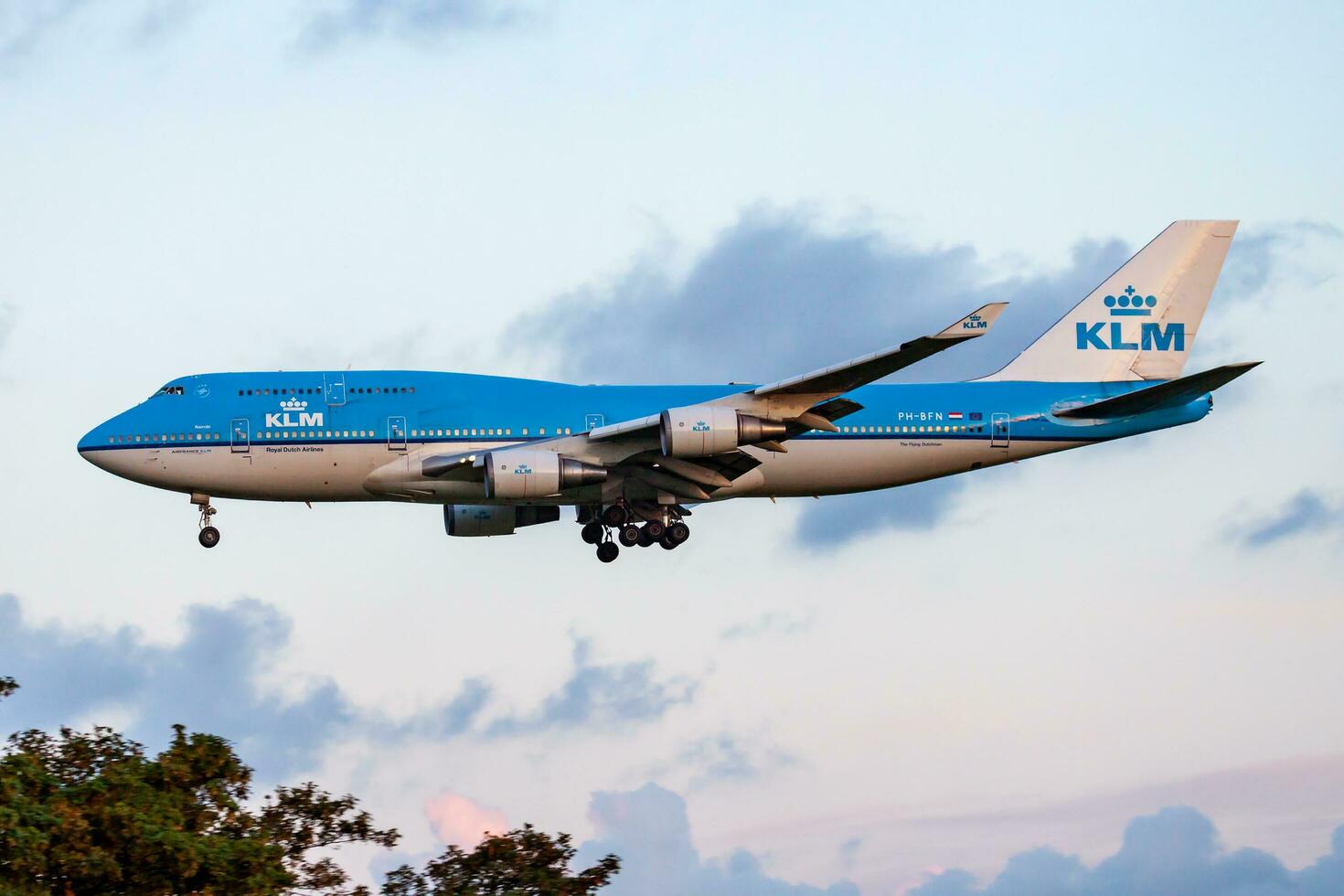 KLM Royal Dutch Airlines Boeing 747-400 PH-BFN passenger plane arrival and landing at Amsterdam Schipol Airport photo