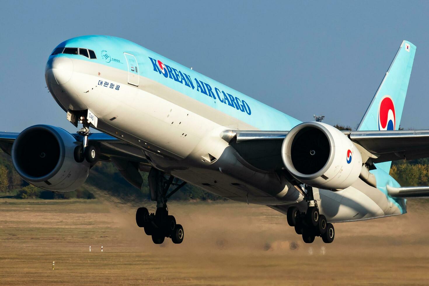 Korean Air Cargo Boeing 777-200 cargo plane at airport. Air freight and shipping. Aviation and aircraft. Transport industry. Transportation. Fly and flying. photo