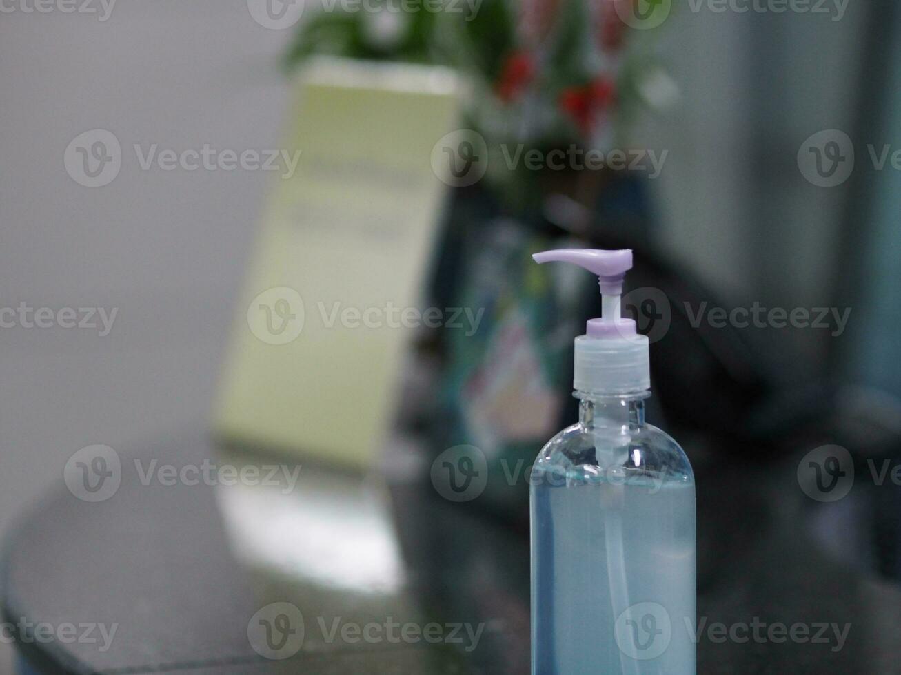 Hand Sanitizer, gel alcoholic mixture with gelatin in clear Plastic bottle with pump pushing wash clean dirty to prevent germs protect Contagious disease corona virus, covid-19 photo