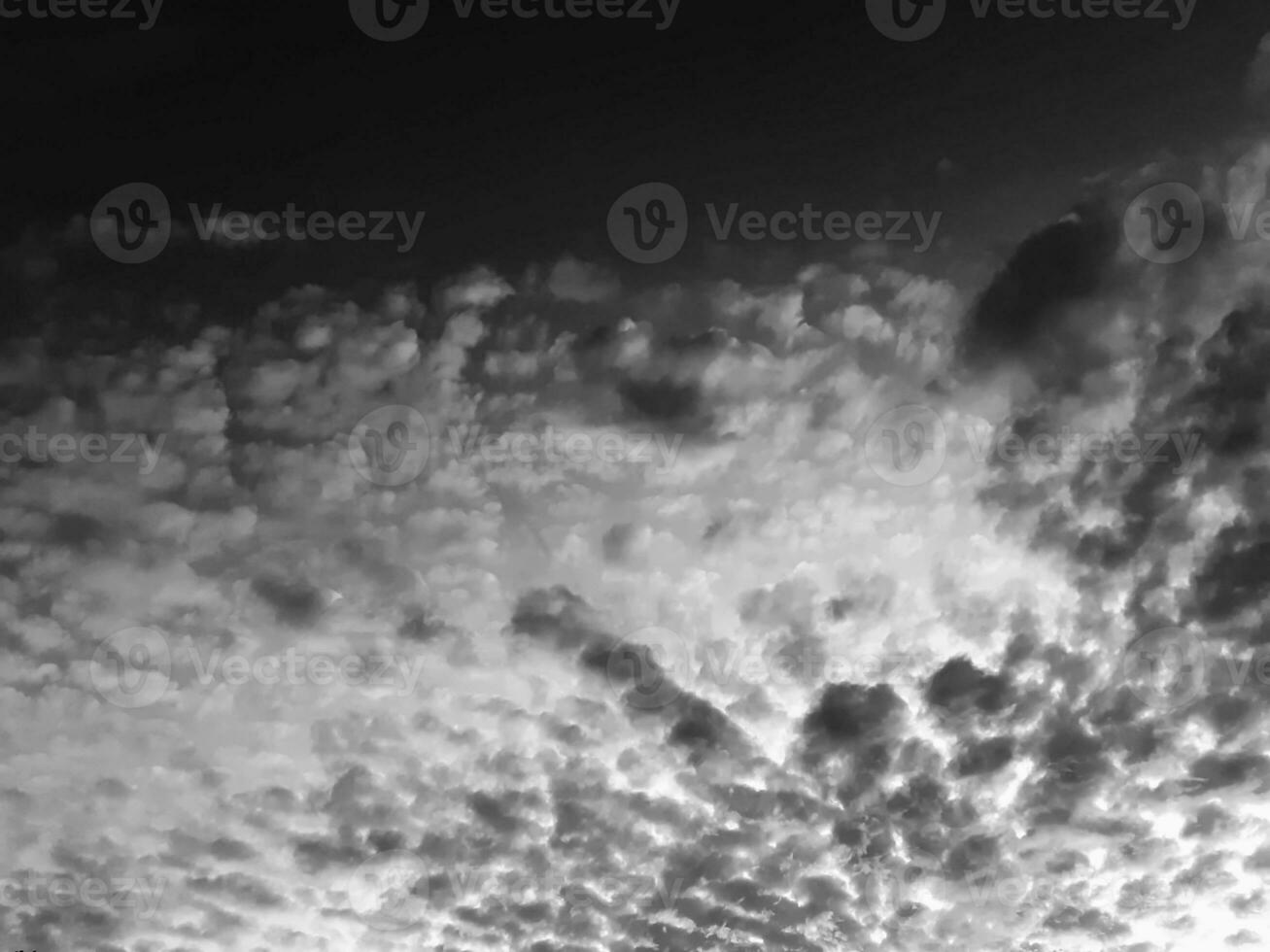 Create clouds vintage picture, black and white sky looking up at many clouds, with nature atmosphere And charming background retro concept. photo