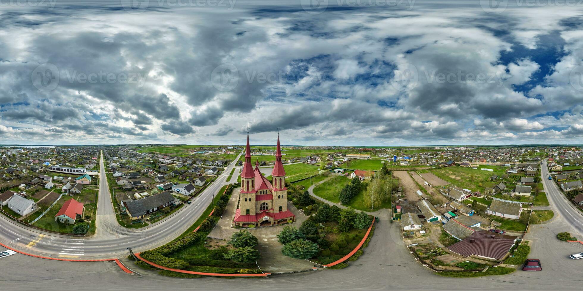 full hdri 360 panorama aerial view on red brick neo gothic catholic church in countryside or village in equirectangular projection with zenith and nadir. VR  AR content photo