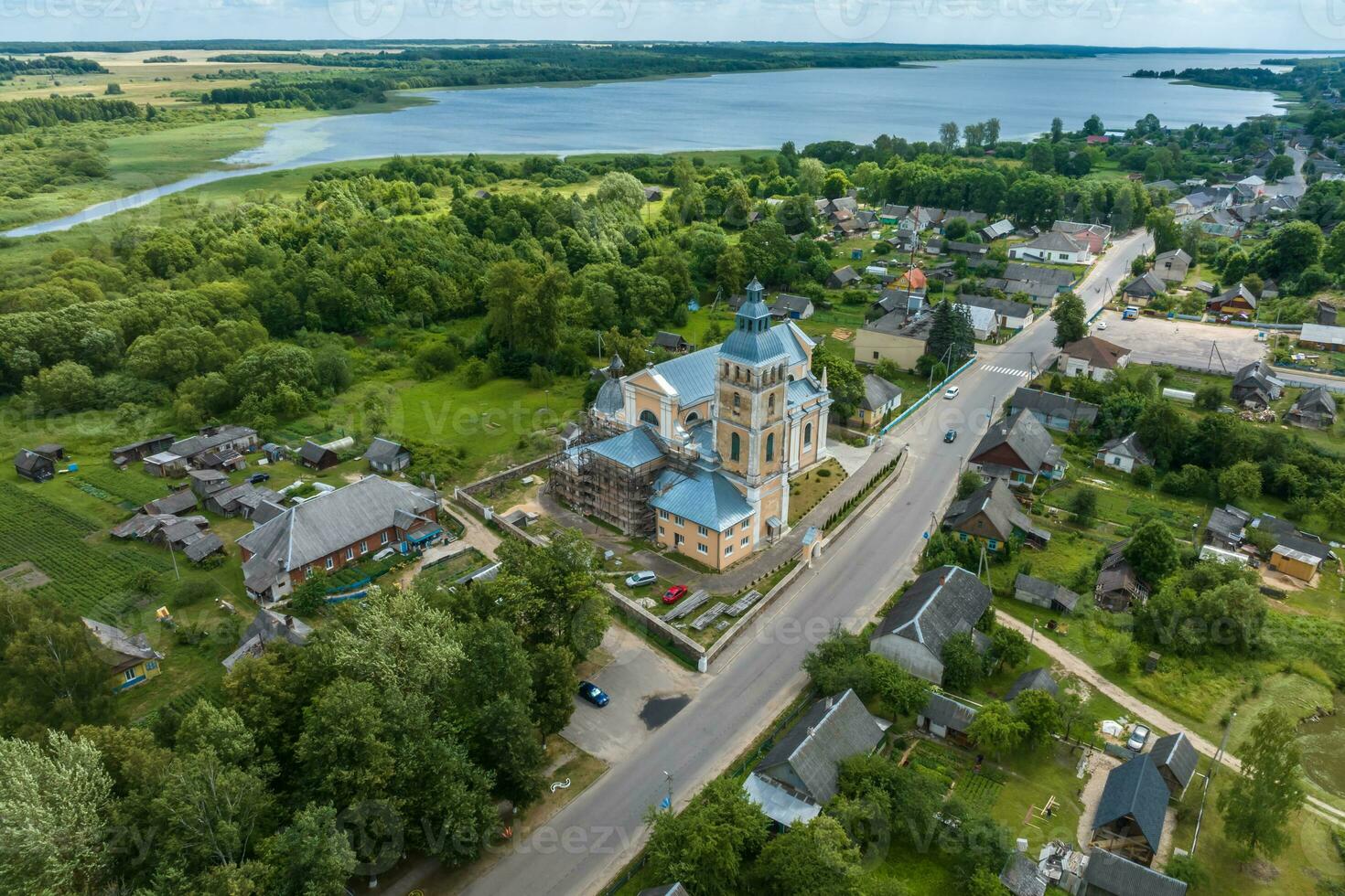 aerial view on neo gothic or baroque temple or catholic church in countryside photo