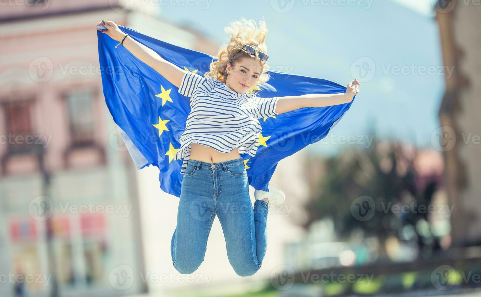 Attractive happy young girl with the flag of the European Union photo