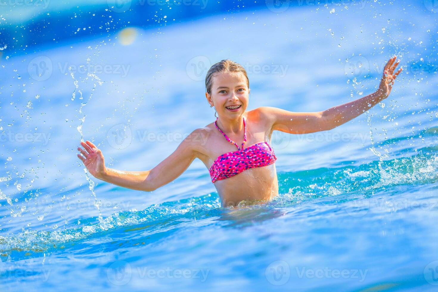 Happy teen girl enjoing summer water and holidays in holiday destinations. photo