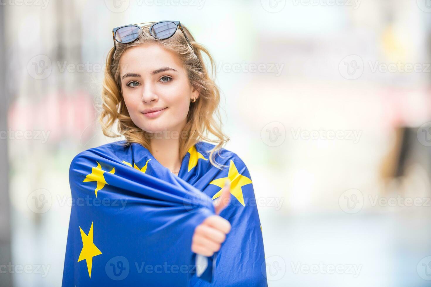 Attractive happy young girl with the flag of the European Union photo