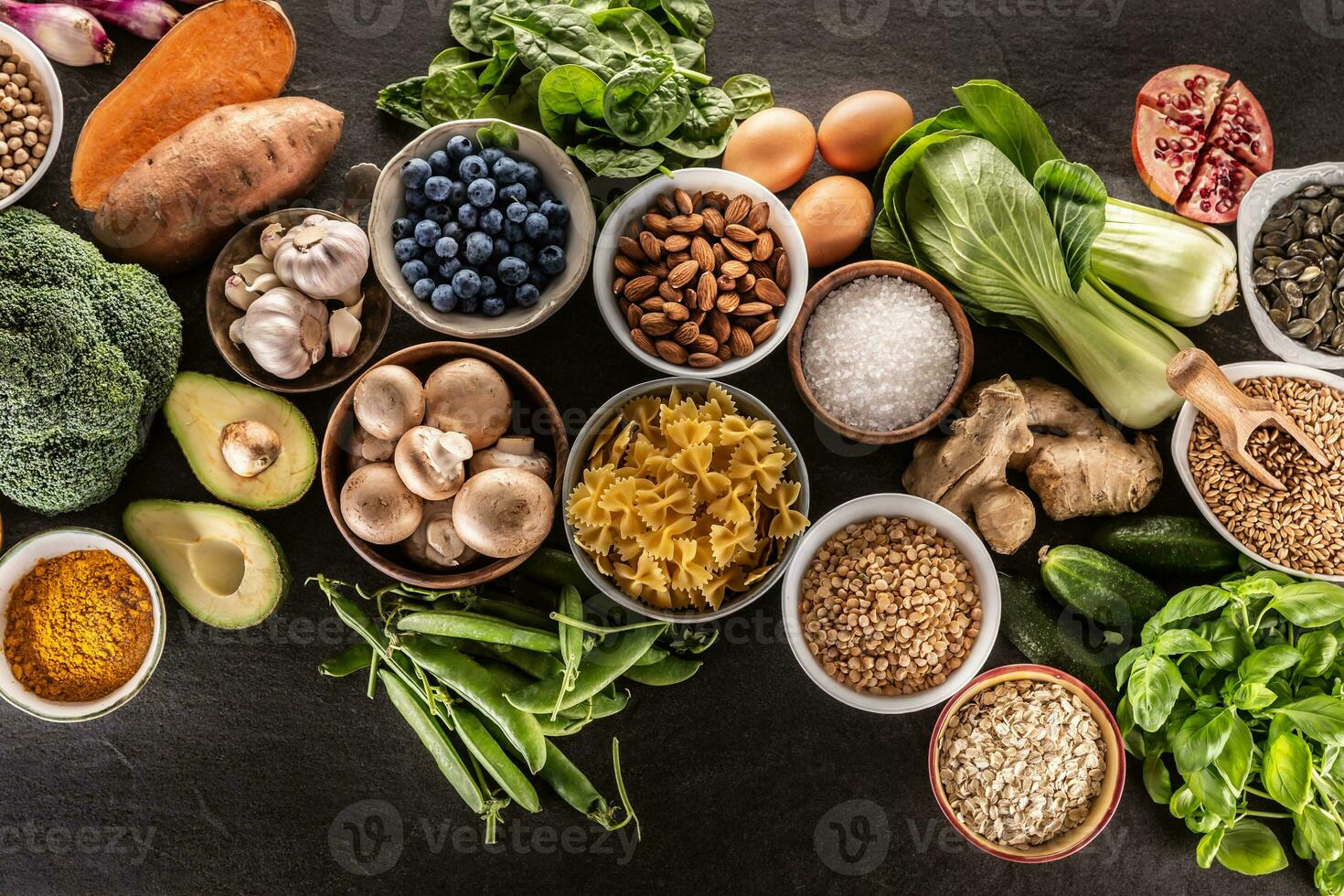 Choice of fresh food and healthy eating. vegetables, fruits, legumes and cereals on a concrete table. photo