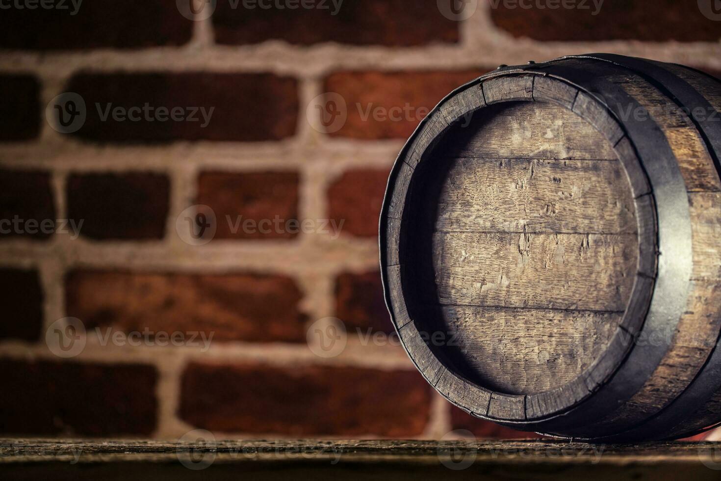 Wine beer cognac whiskey or rum barrel on wooden table photo