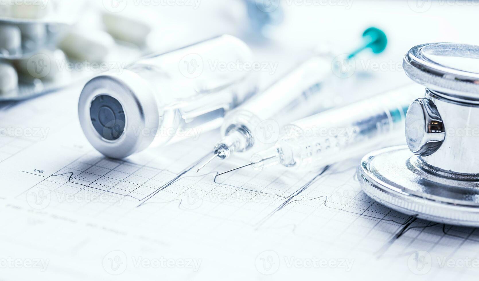 Stethoscope injections pills on the  EKG graph. photo