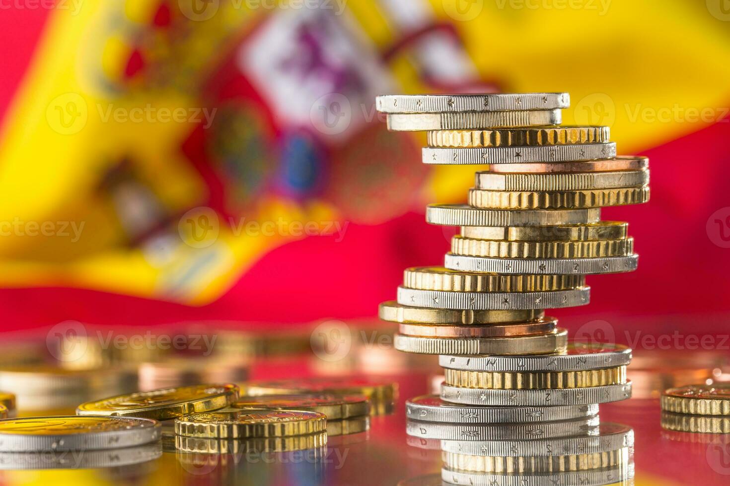 National flag of spain and euro coins - concept. Euro coins. Euro money. Euro currency photo