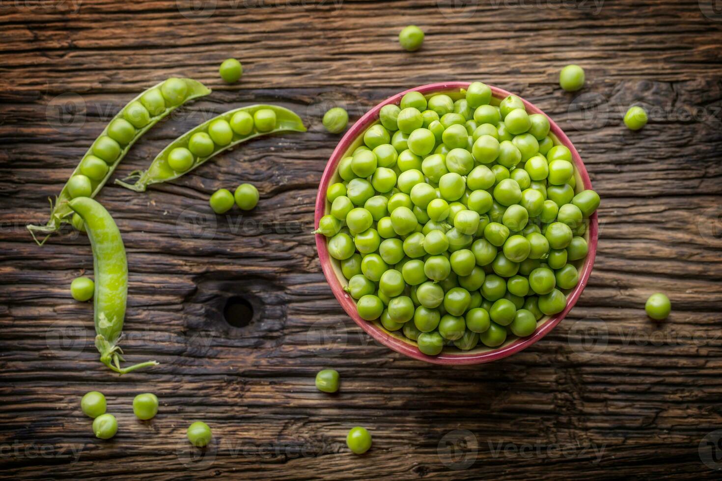 Peas. Fresh bio homemade peas and pods on old oak board. Healthy fresh green vegetable - peas and pods. photo