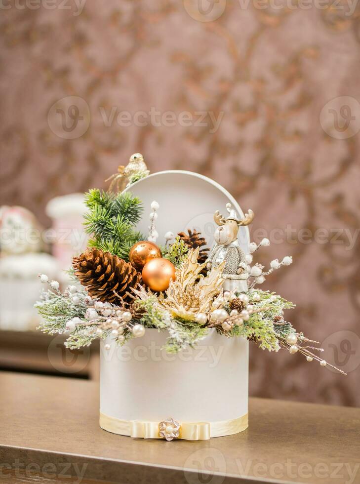 Luxury Christmas gift box in flower shop with seasonal decoration photo