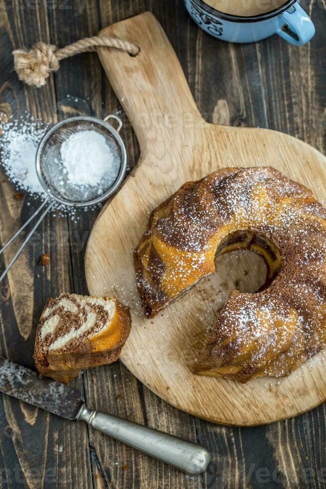 Cake. Marble cake cup of coffee powder sugar kitchen vintage utensil and fresh fruit berries photo